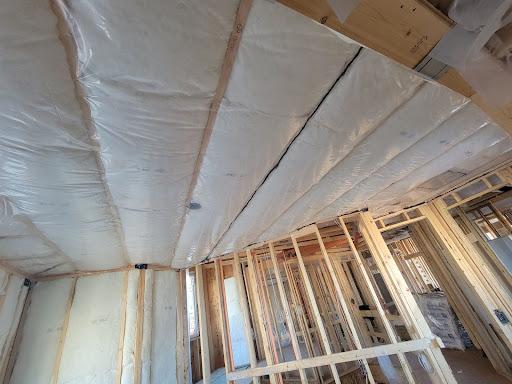 Vapor barrier batten insulation in a ceiling installation.