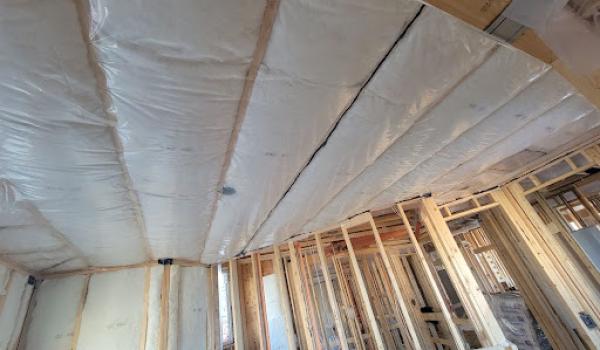 Vapor barrier batten insulation in a ceiling installation. What is a vapour barrier? | Okanagan Insulation Services